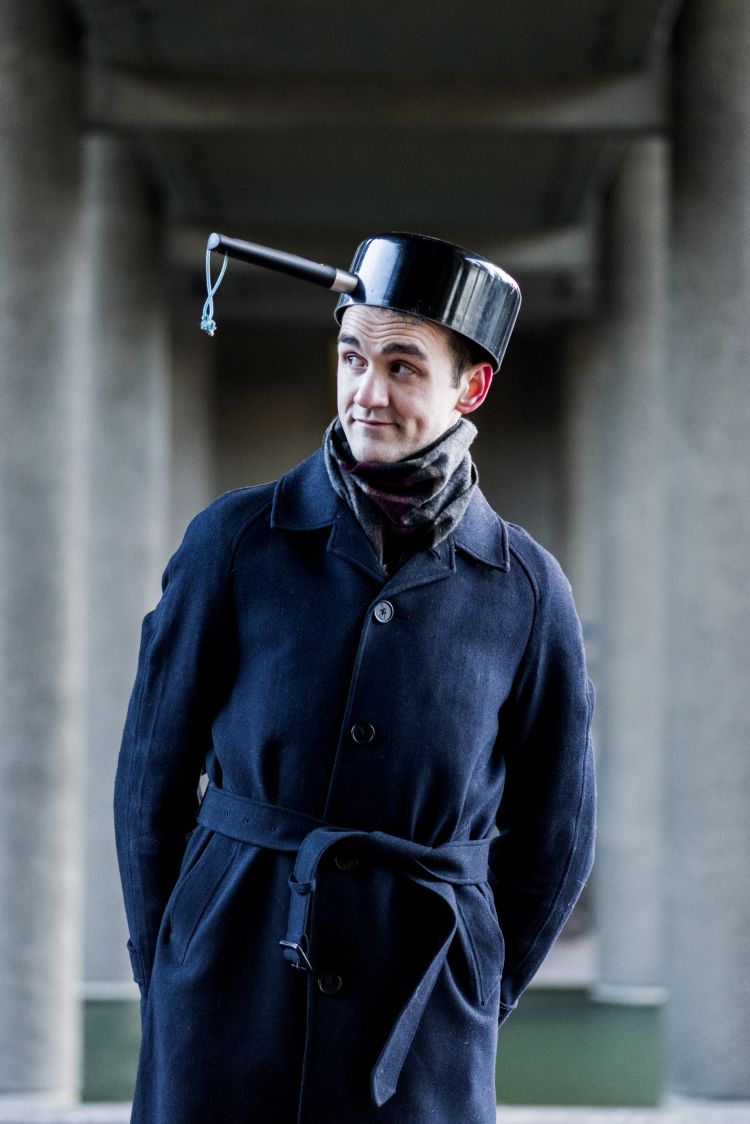 Photo of man with pan on his head