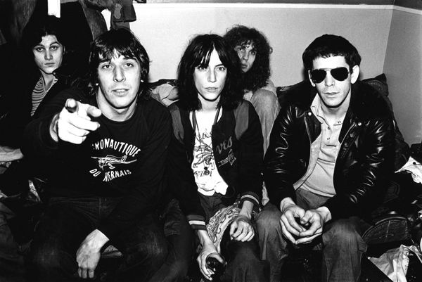 Black and white photo of John Cale, Patti Smith and Lou Reed