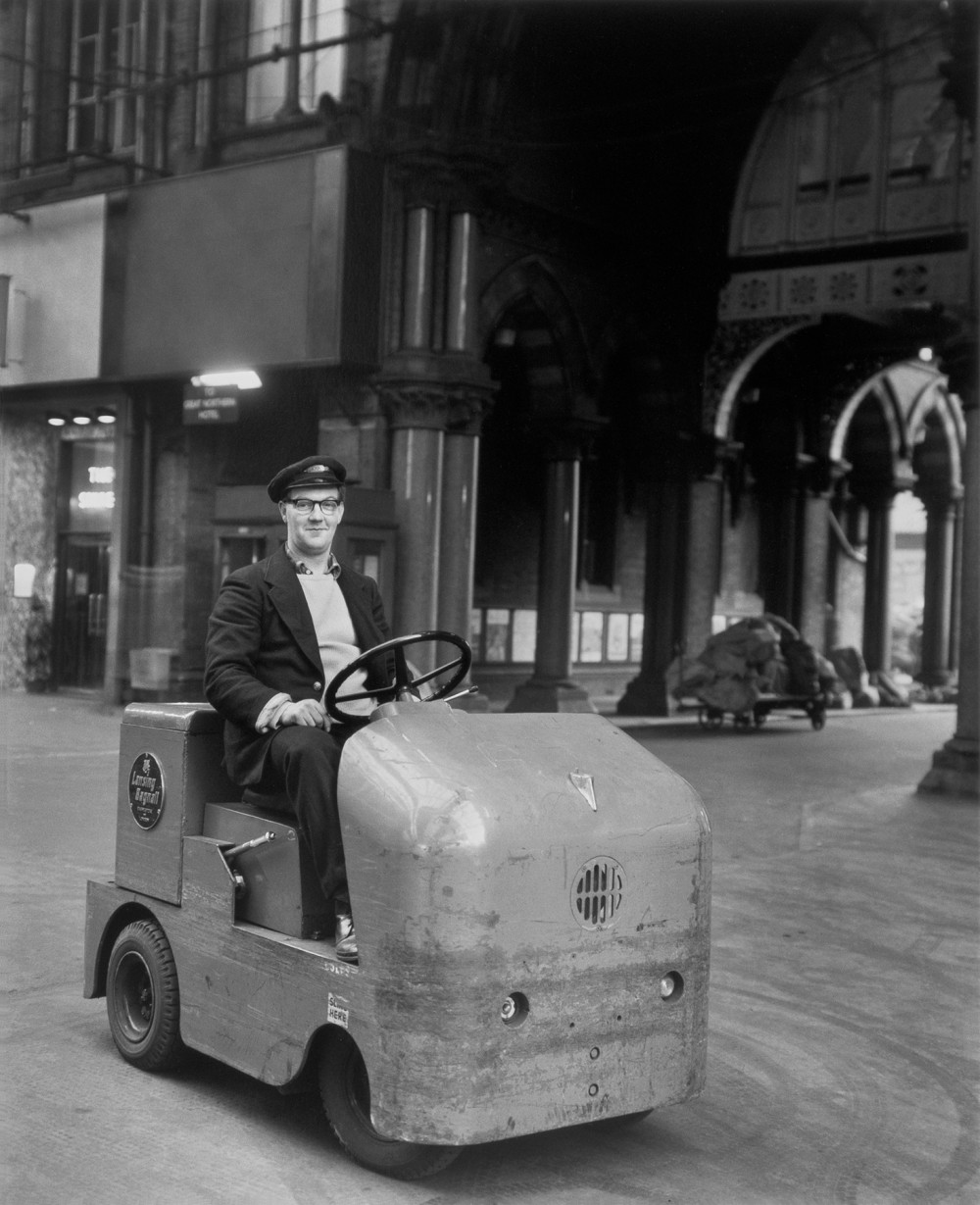 Man on Station Vehicle, St Pancras, London (1962) by Evelyn Hofer
