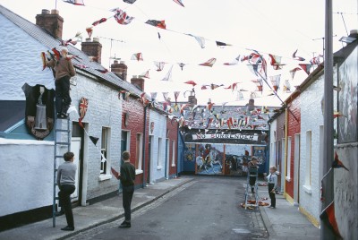 Protestants decorating their homes on the celebration day of the Protestant victory in the Siege of Derry. Derry/Londonderry, Northern Ireland ca. (1969) by Akihiko Okamura